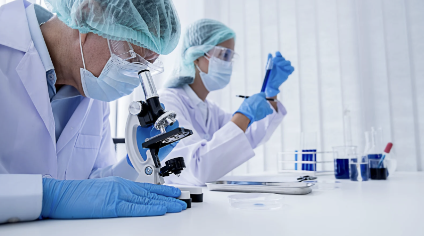 A stock image of scientists performing medical research.