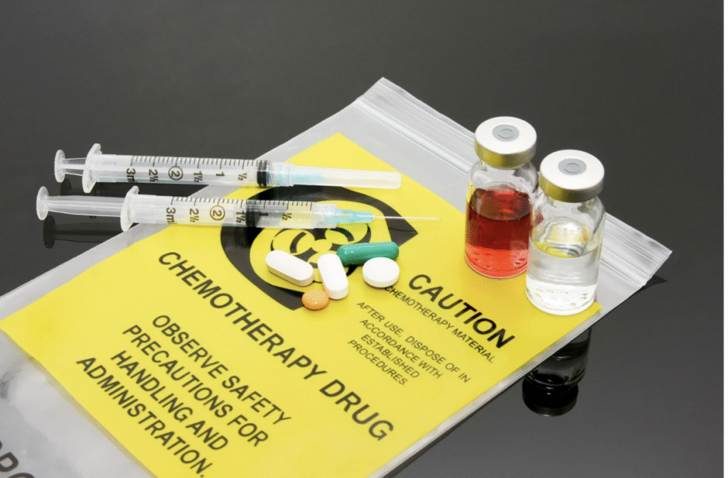 Stock image of various forms of chemotherapy drugs. Vials of medicine, pills, and syringes.