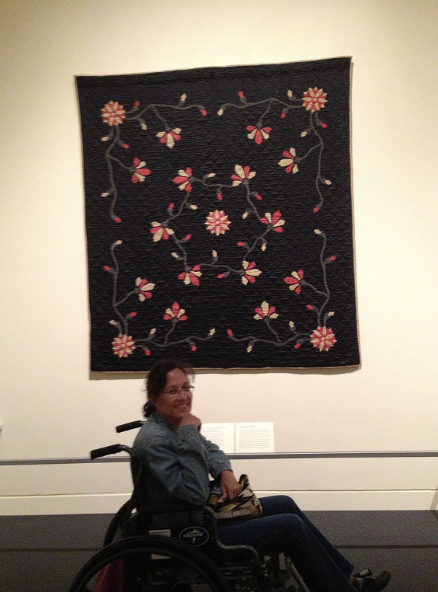 Dr. Yvette Colón needing to use a wheelchair to get around.